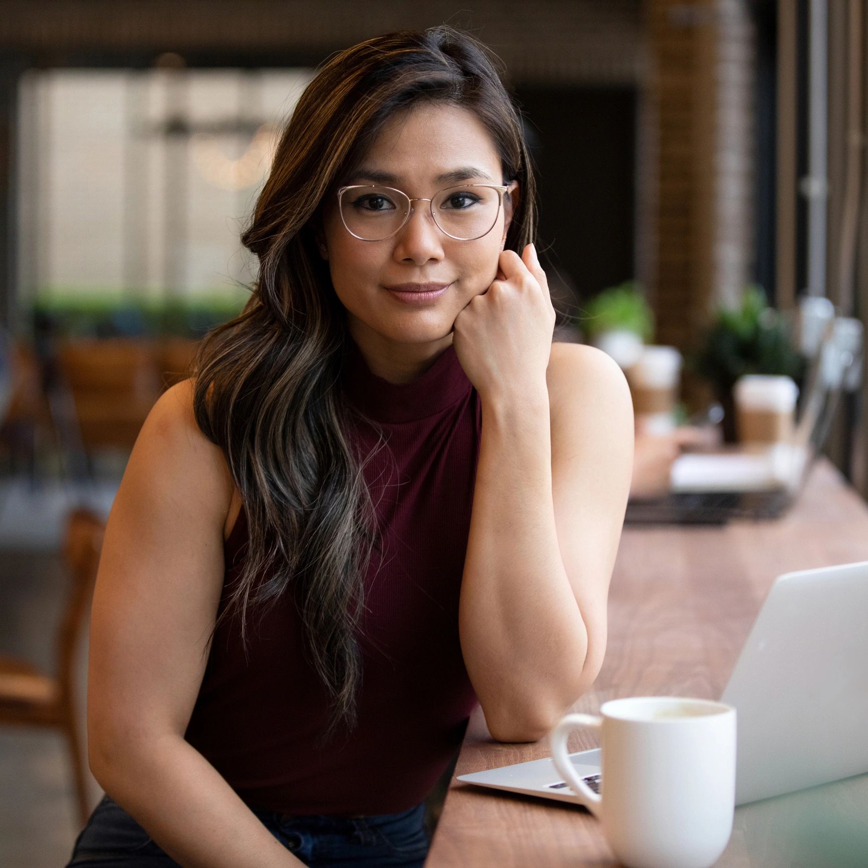 Portrait of customer smiling in a coffee shop