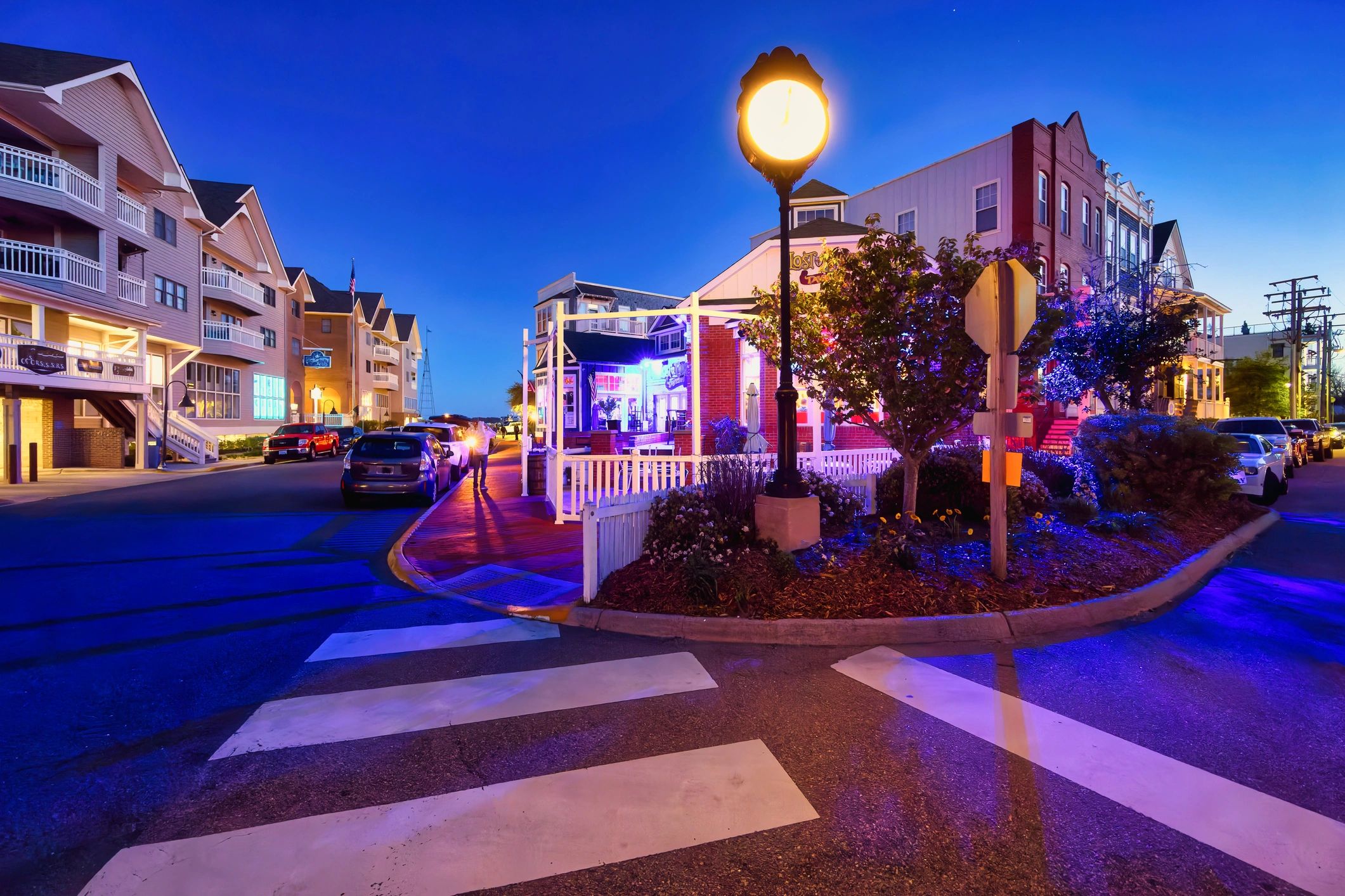 Warm café storefront exterior at dusk